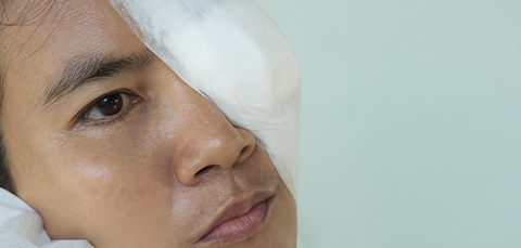 Person with eye patch after dry eye complications, illustrating risk of vision loss from severe dry eye disease.