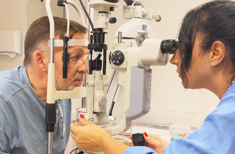 Man undergoing detailed eye examination before laser eye surgery in Turkey, guided by ophthalmologist