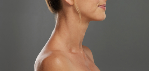 profile view of woman with smooth defined neck illustrating nefertiti lift treatment  