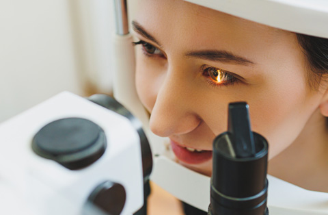 Young woman undergoing SMILE laser eye surgery exam in Turkey, showing advanced vision correction procedure